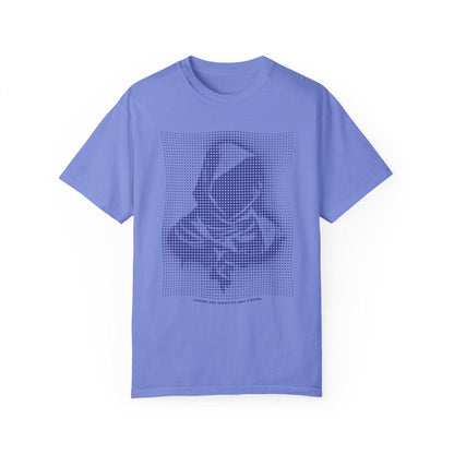 A light blue graphic tee shirt featuring a pixel art design of a hooded figure with the text "We Are Not Yet Finished," perfect for techwear fashion and futuristic clothing enthusiasts. This mens graphic tee embodies an edgy fashion vibe, ideal for urban clothing looks.