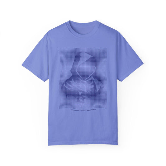 A light blue graphic tee shirt featuring a pixel art design of a hooded figure with the text "We Are Not Yet Finished," perfect for techwear fashion and futuristic clothing enthusiasts. This mens graphic tee embodies an edgy fashion vibe, ideal for urban clothing looks.