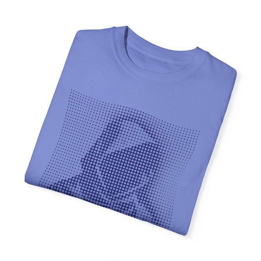 A folded light blue oversized t shirt showcasing a digital print of a hooded figure in a minimalist techwear style. This unique graphic t shirts mens piece is perfect for cyberpunk outfits and futuristic fashion lovers seeking modern urban clothing.