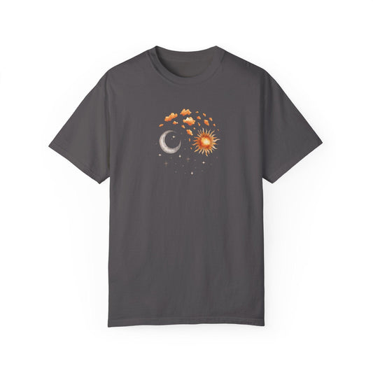 A gray minimalistic tee showcasing a cosmic energy tee design with a sun and moon graphic in orange and gray, surrounded by stars and clouds. This aesthetic shirts piece is ideal for spiritual shirts lovers and those into astrologer clothing.