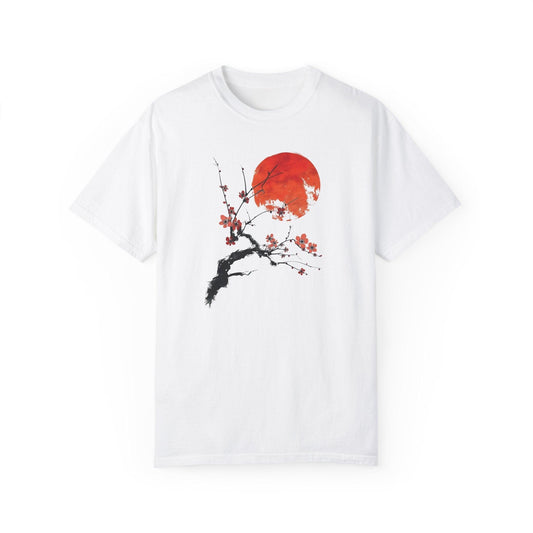 White artist graphic tee with a minimalist print depicting a cherry branch (sakura) and a red sun in a Japanese aesthetic, perfect for Tokyo fashion style and streetwear graphic tees.