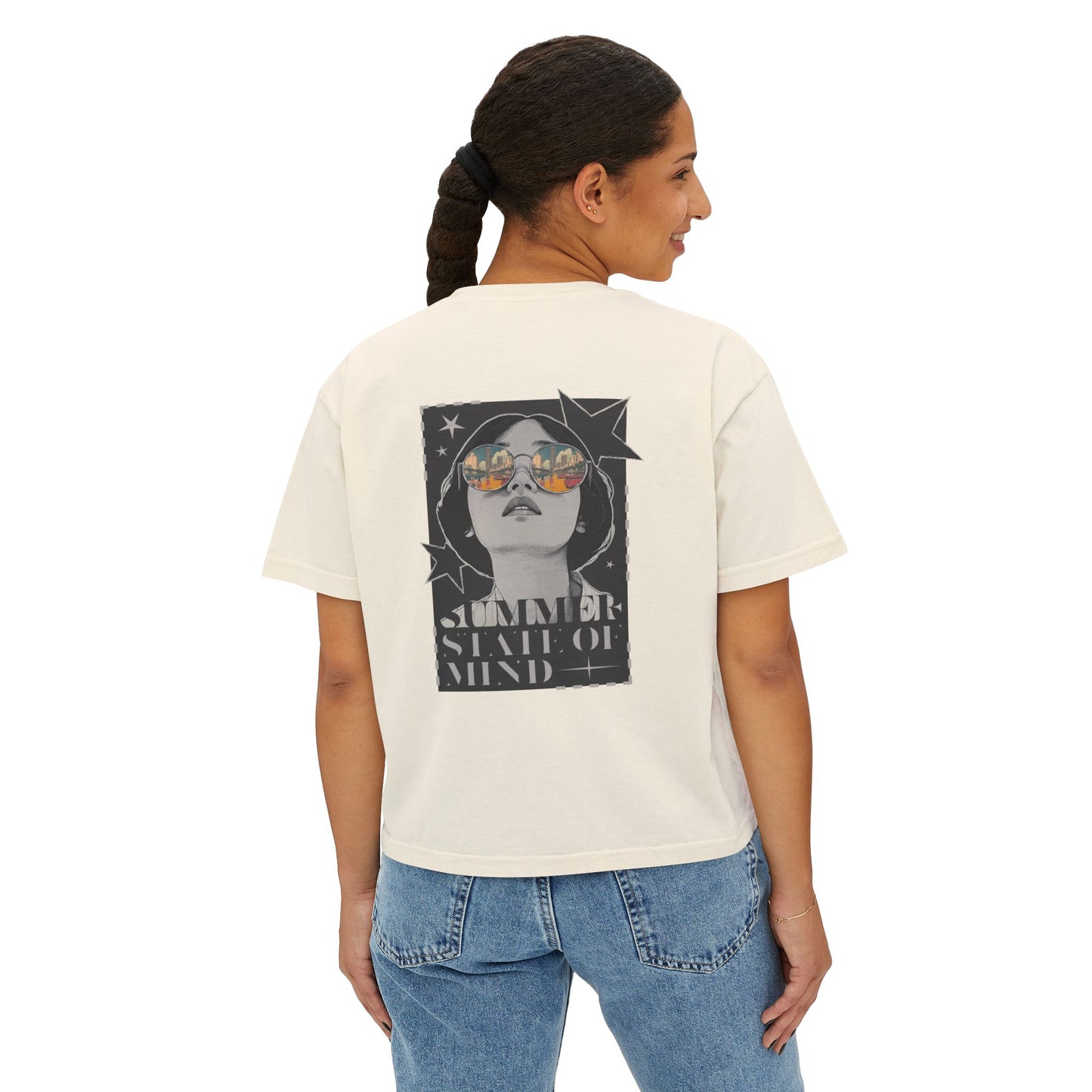 Back view of a woman wearing a summer cropped shirt with a large retro-style print of a woman in sunglasses and the text "SUMMER STATE OF MIND" on the back.